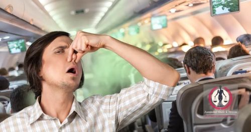 Passenger holding nose as toxic fumes spread inside airplane cabin – New Jersey Airplane Accident Lawyer perspective on airline injury claims.